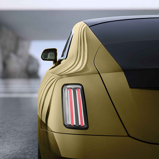 Rear detail shot of gold 2023 Rolls-Royce Spectre